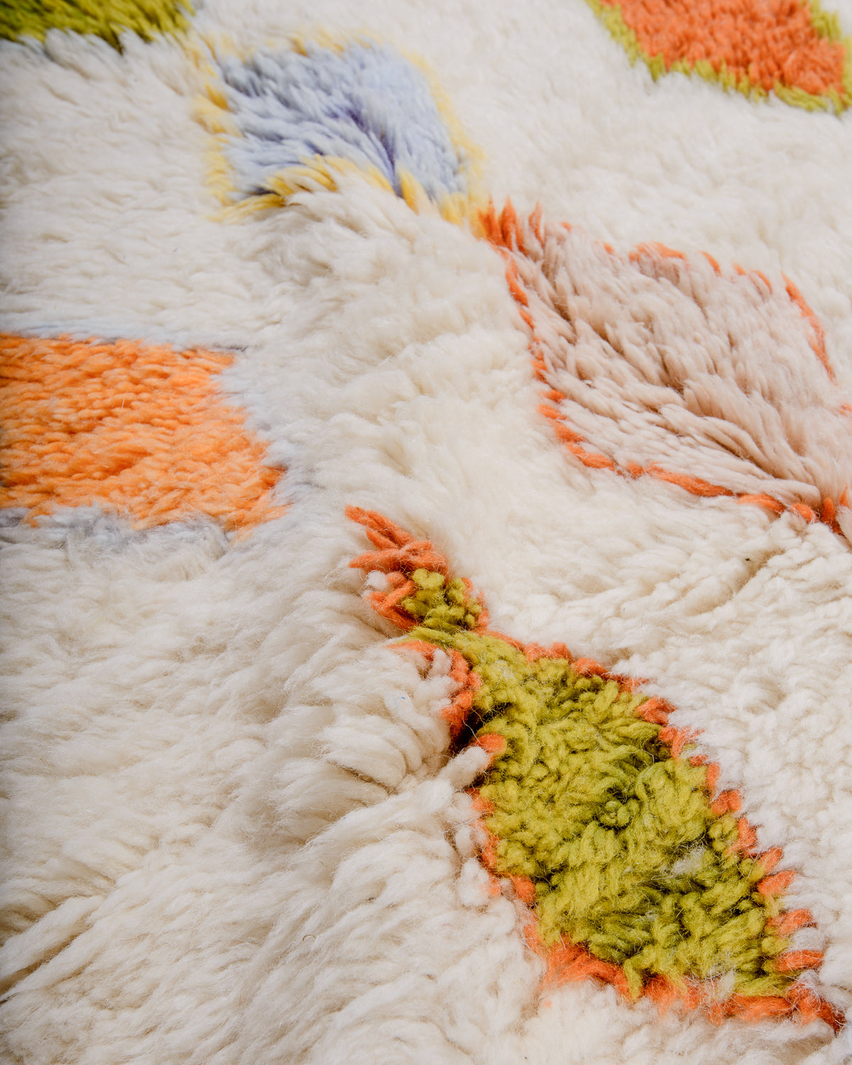 Soft and fluffy surface texture of Berber wool rug.